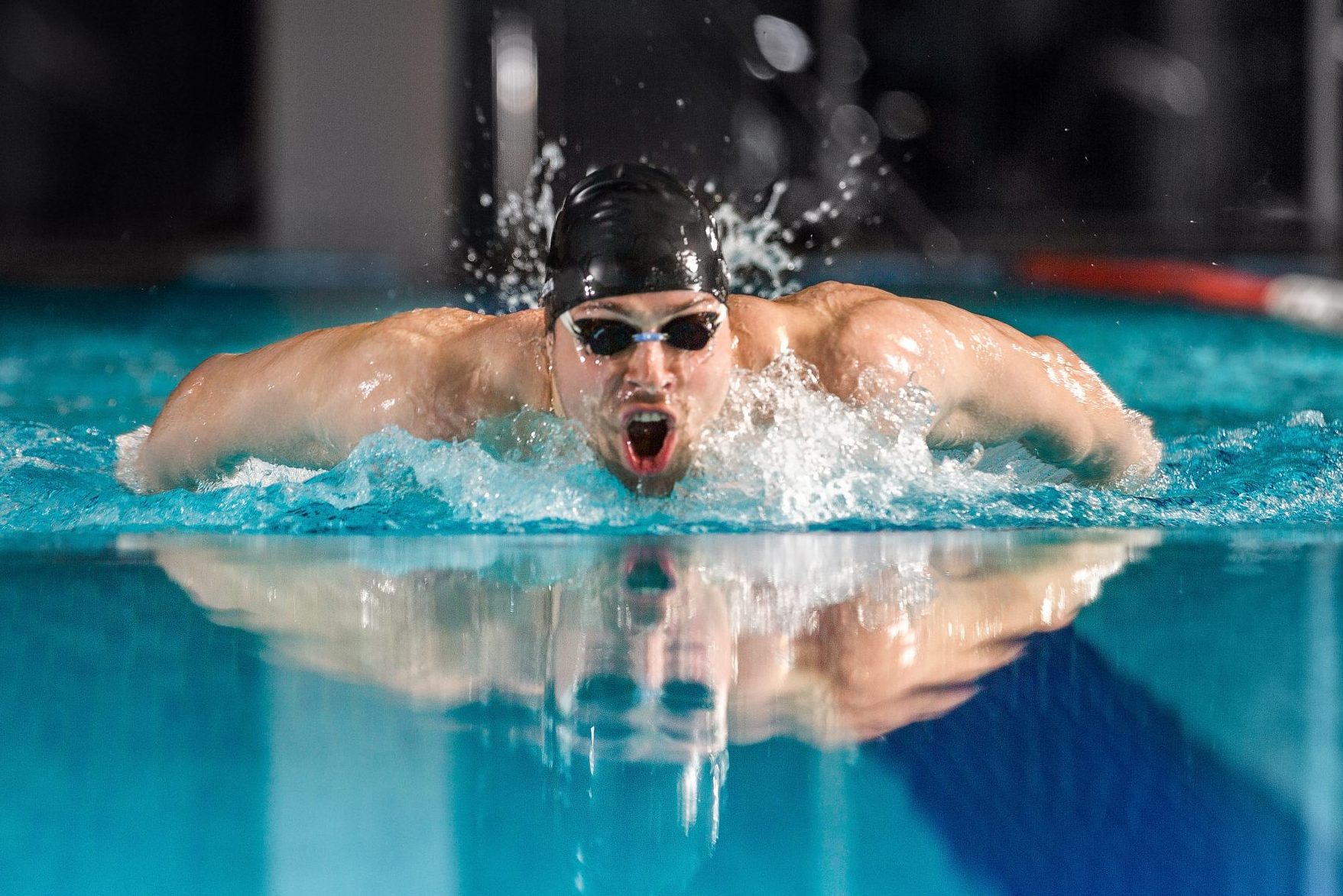Male swimmer swimming the butterfly stroke